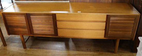 Teak extending dining table (A H MacIntosh & Co, Kirkaldy) and a similar sideboard(-)
